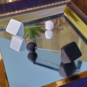 : Black and white magnetic shoulder hijab clips for securing a hijab or stole comfortably