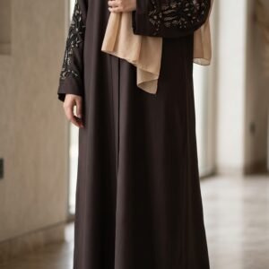 Chocolate brown abaya with intricate gold-toned floral embroidery on the sleeves, paired with a beige hijab | Azmira Collection