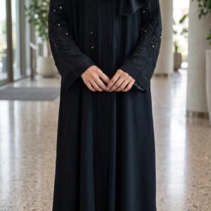 Black abaya with intricate black bead embroidery on the sleeves and front, paired with a matching black hijab | Azmira Collection