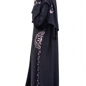 Black abaya with delicate white floral embroidery along the side and sleeves, paired with a matching black niqab | Azmira Collection
